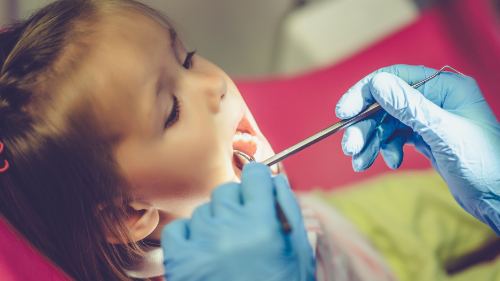 child at the dentist having a dentistry check up